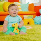 BRIGHT STARTS Játék dallamokkal C-karikán Tug Tunes™ zsiráf 0hó+